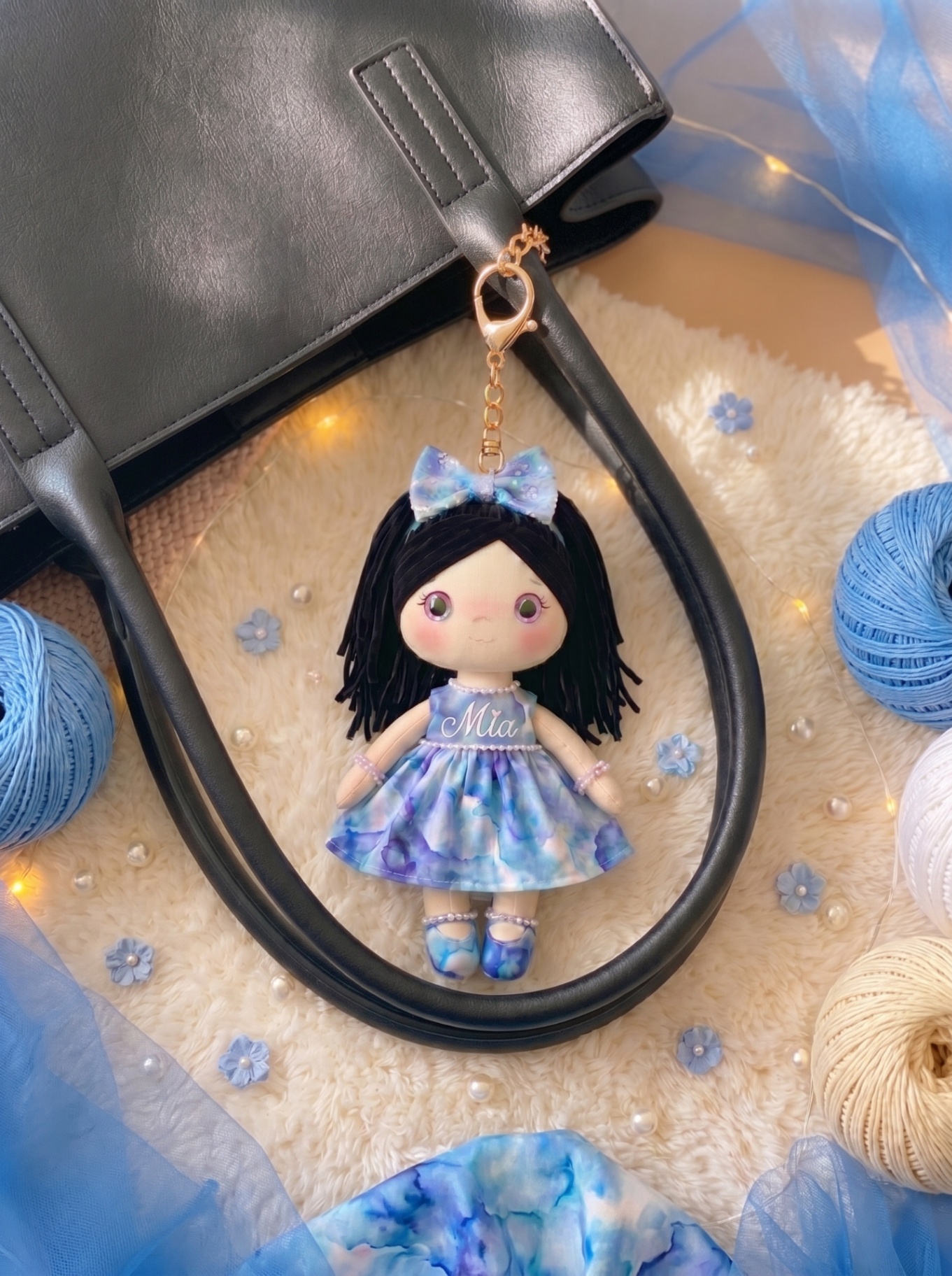 Ocean Dream bag charm styled on a tote bag with personalized embroidery on the body.