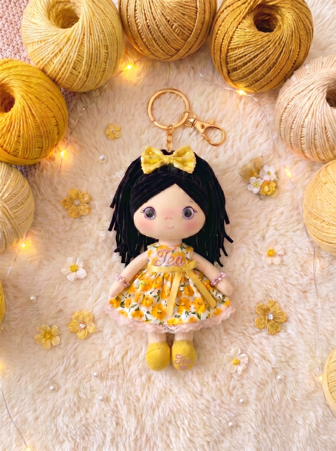 Sunshine keychain with gold hardware and personalization on both body and sole.