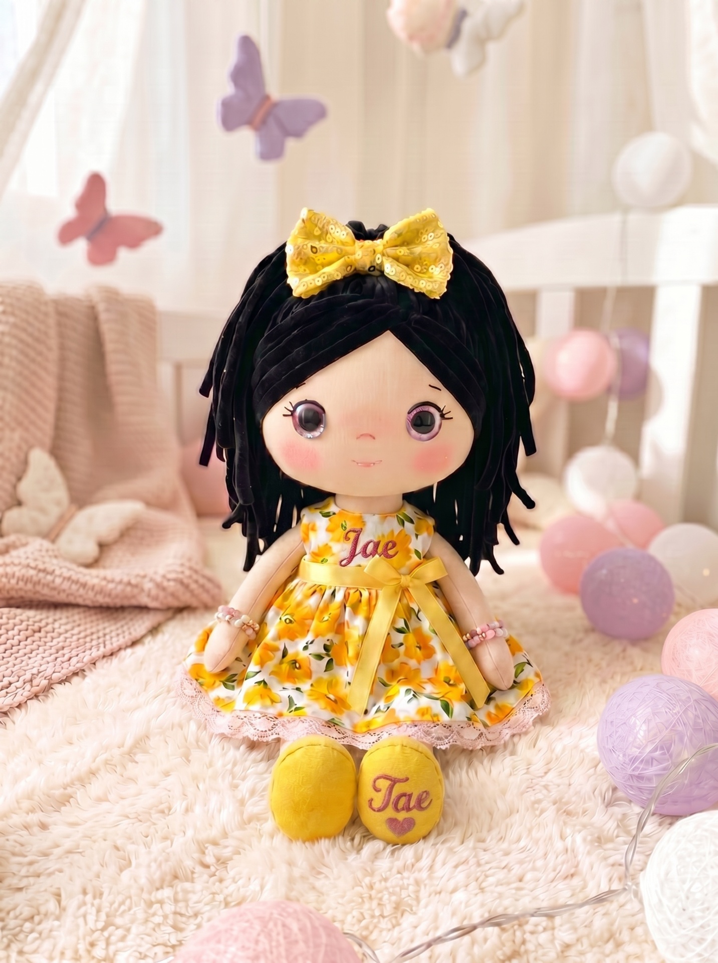 Sunshine doll with personalized embroidery on both the bodice and the shoe sole.